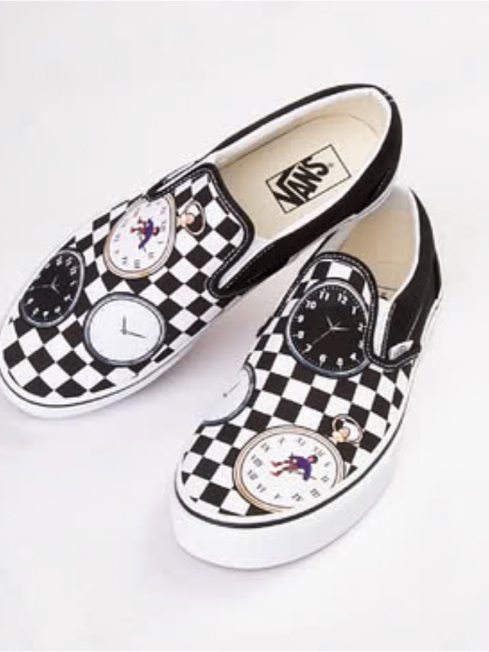 Karl Jacob’s x Vans Slip-On Sneakers in 
Checkerboard Time Traveler Tales